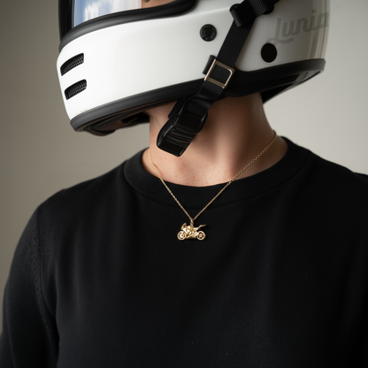 Hand Made biker necklace motorcycle pendant in 14K gold and silver on display