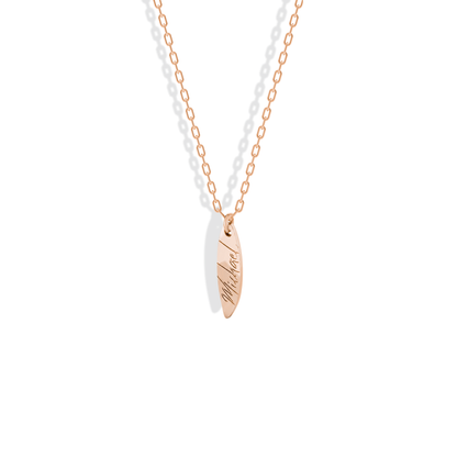 Personalised board pendant in 14K rose gold, the name engraved from nose to tail