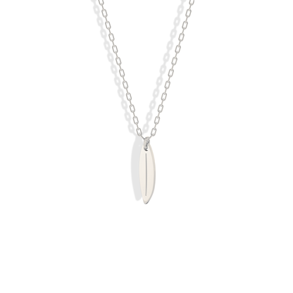 Clean white gold surfboard charm, cool toned for summer layering