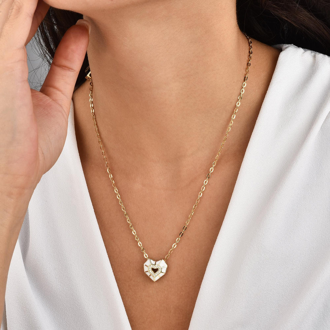 Model wearing the White Mosaic Heart necklace, highlighting its elegant design and subtle sparkle.